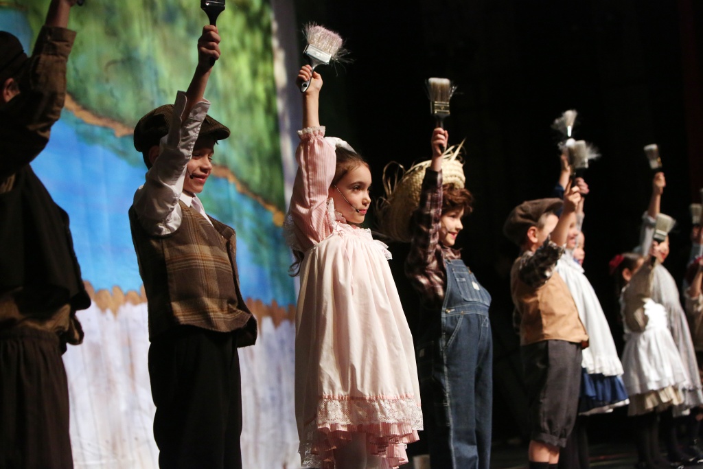 Tom Sawyer cast members on stage