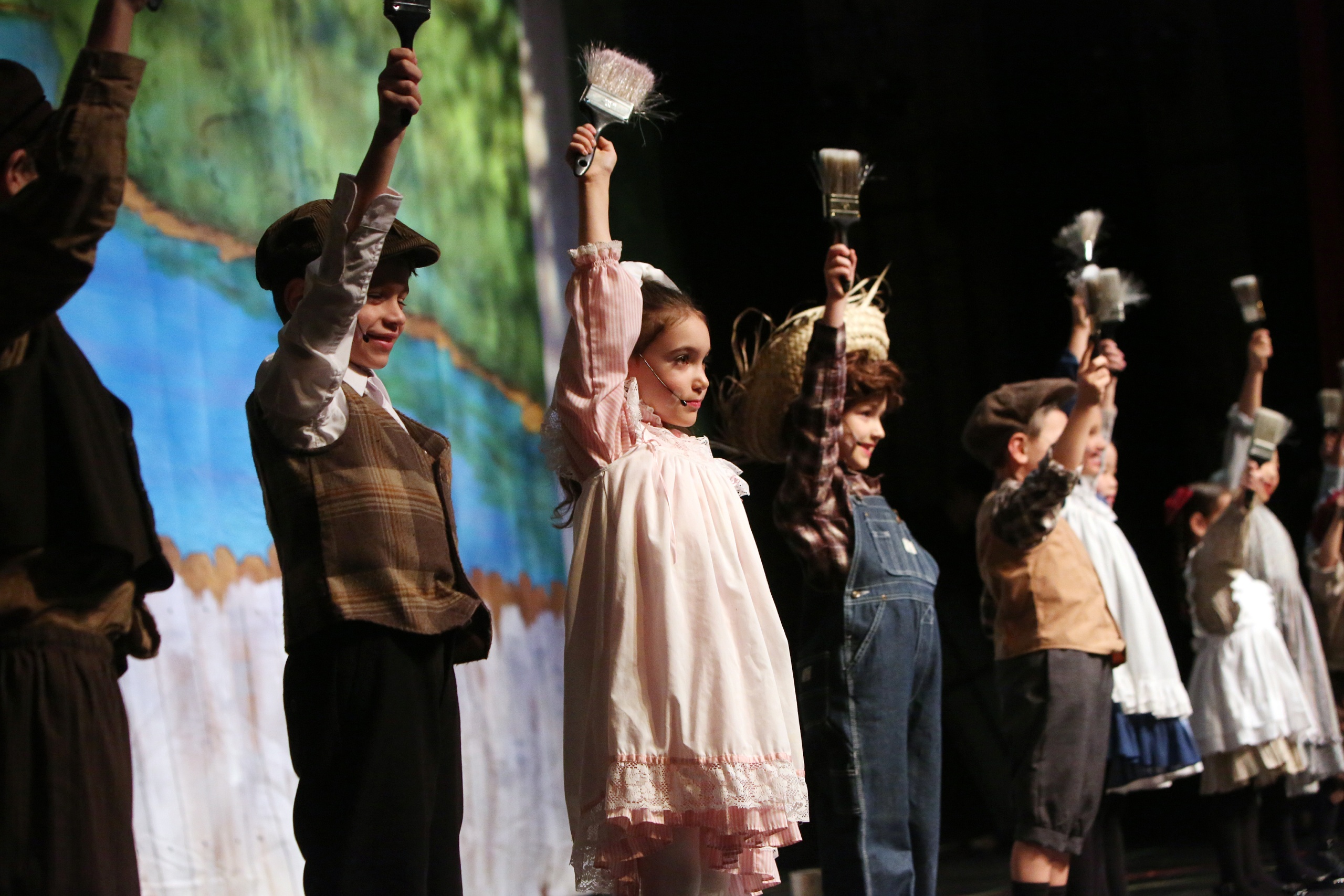 Tom Sawyer cast members on stage