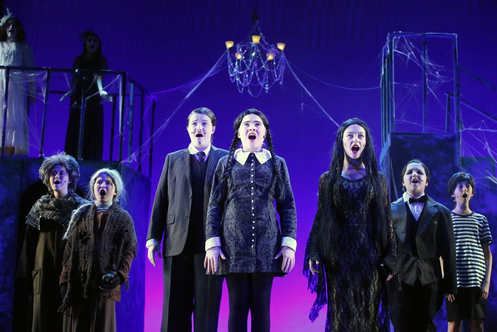 Cast members on stage.