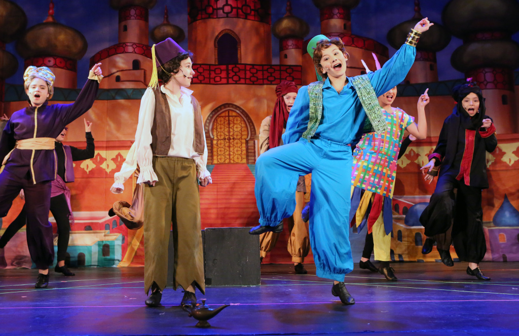 Actors performing on stage.