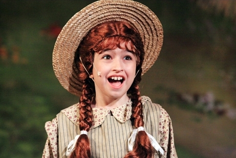 A young actress in an Anne of Green Gables costume