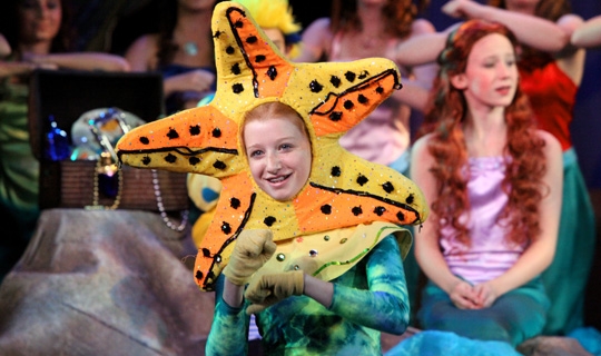 Actors in costumes from Little Mermaid Jr