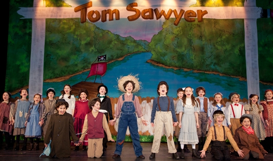 Actors in costumes from The Adventures of Tom Sawyer