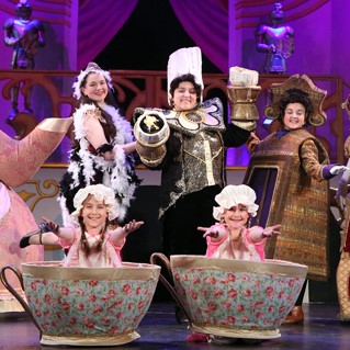 Cast on stage during a performance