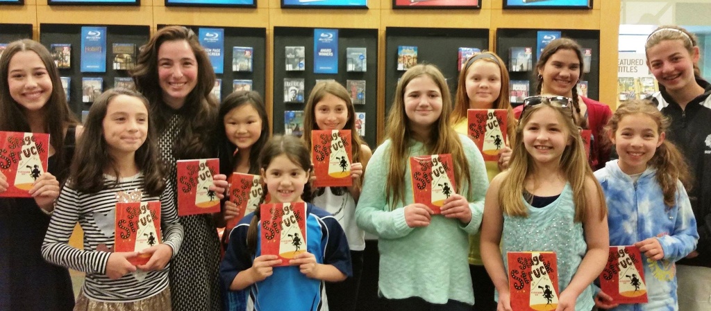 Children holding copies of the books