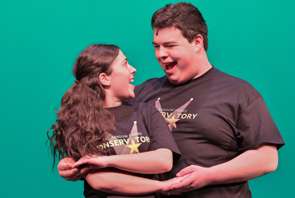 A female and male rehearsing.