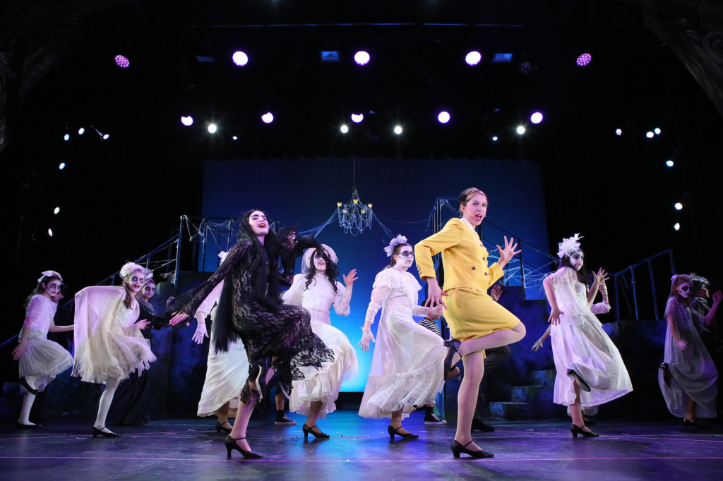 Cast members on stage.