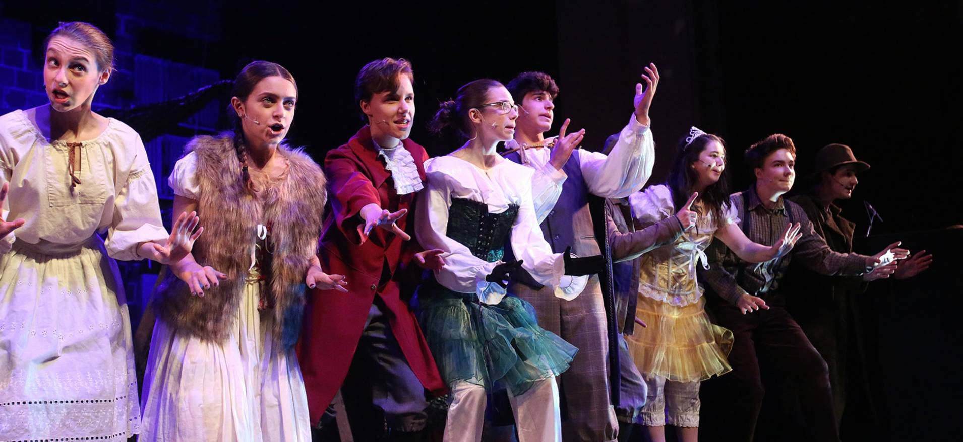 Cast members on stage.